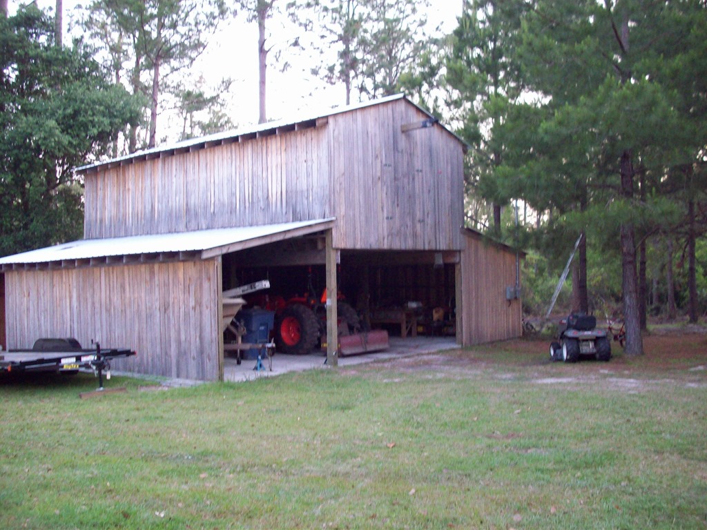 Three stall barn with second level loft built with sawmill lumber