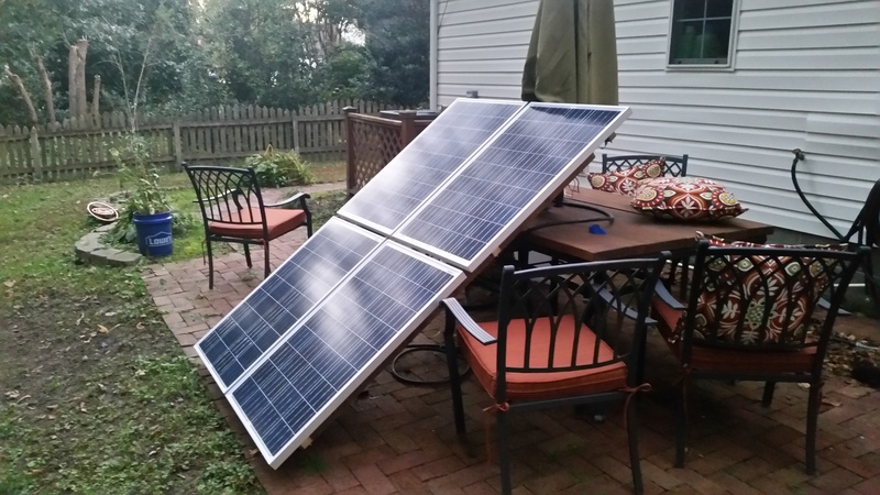 Solar array leaning on a picnic table during testing