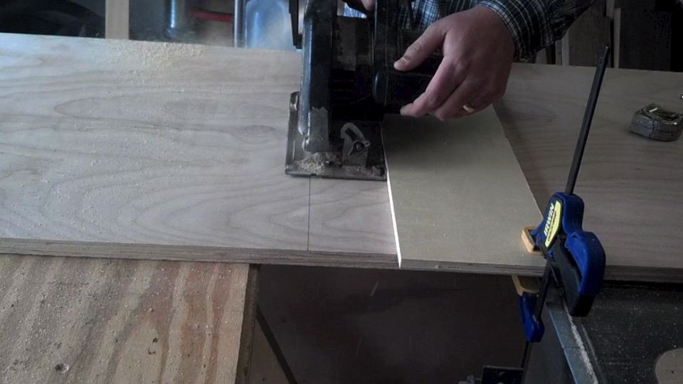 Cutting plywood with a clamped straight board