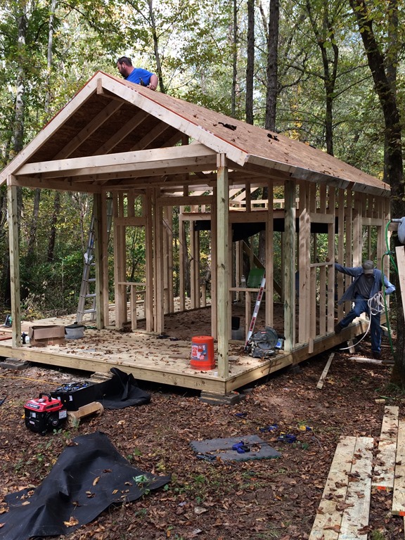 Plywood roof sheathing being installed