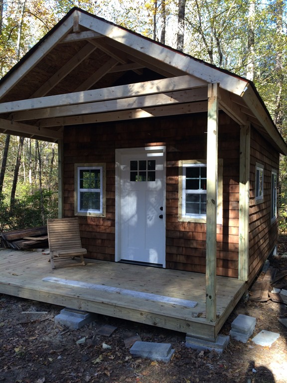 Tiny cabin with roofing and partial siding installed