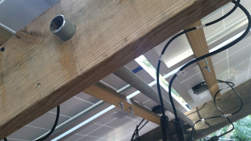 Underside of the solar array showing temporary connections and panel mounting