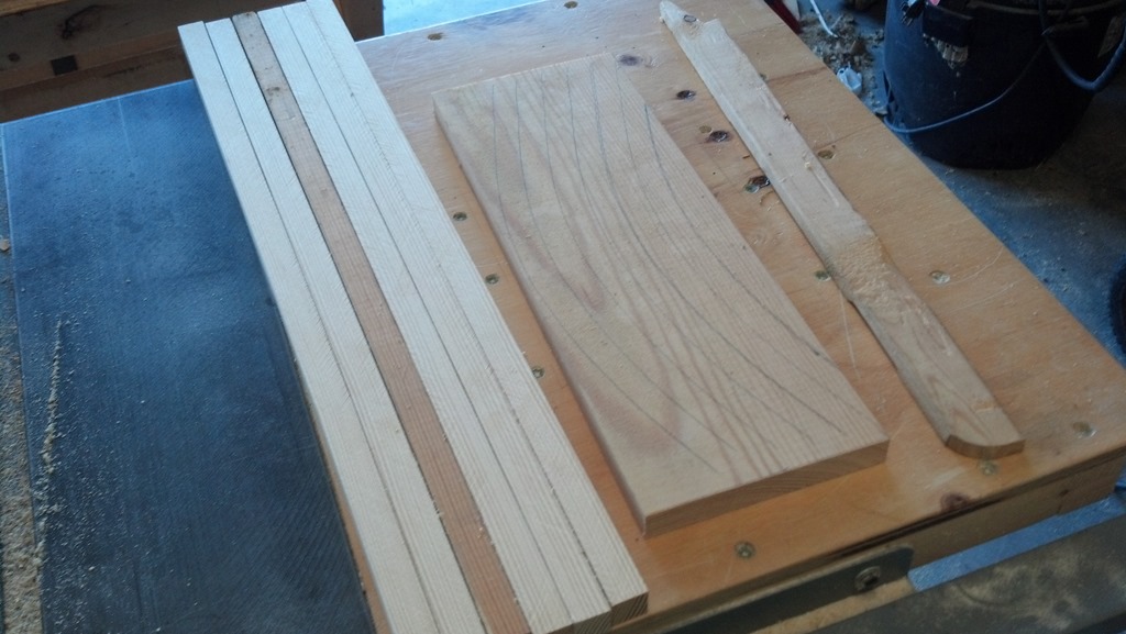 Three wooden backpack frame parts cut from construction lumber